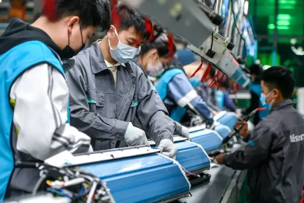 Manufacturing worker preparing goods on a production line